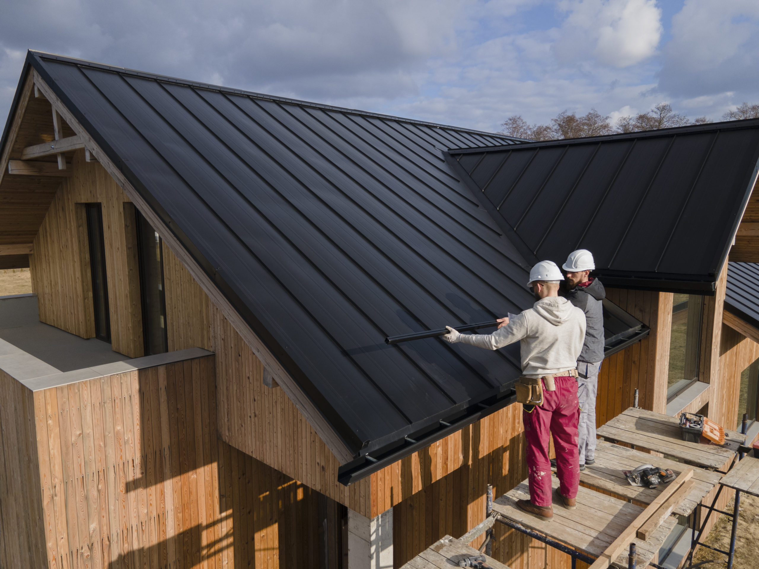 full-shot-roofers-working-with-helmets